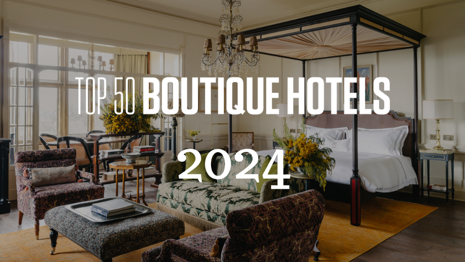 Image of grand hotel room with Top 50 Boutique Hotels logo over top